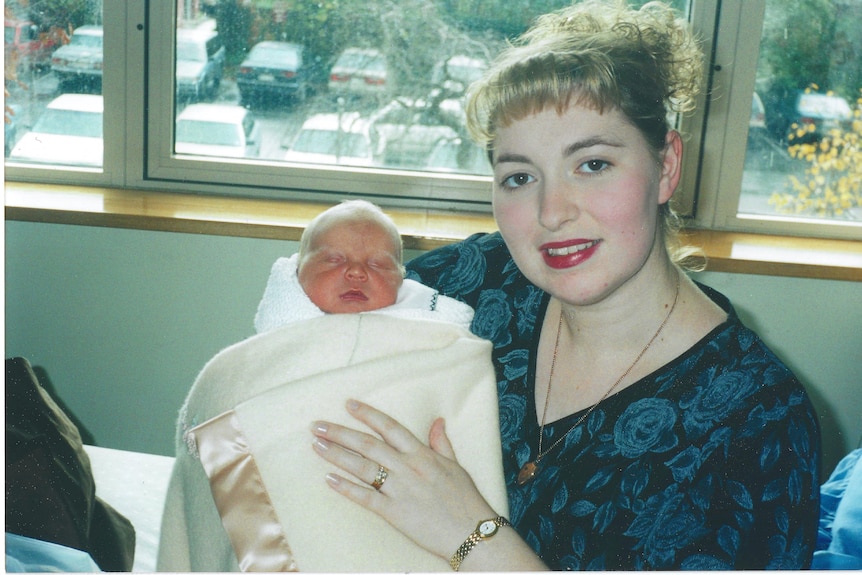 Amanda holds her son Gabriel when he was a baby.