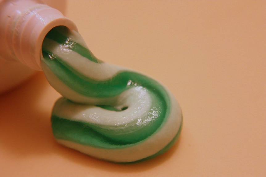toothpaste squeezing out of tube 