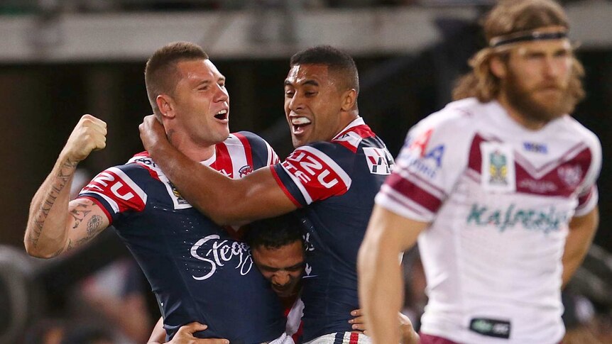 Shaun Kenny-Dowall and Roger Tuivasa-Sheck celebrate for the Sydney Roosters in the NRL Grand Final.