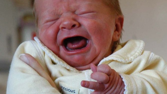 A newborn baby finds it hard to settle down.