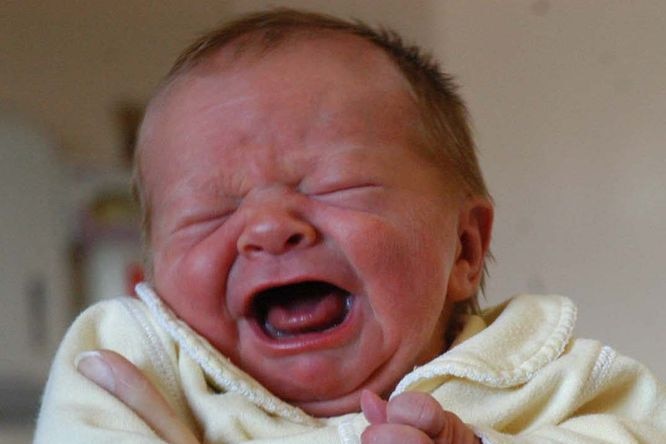 A newborn baby finds it hard to settle down.