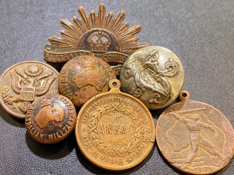 Seven metal items found while prospecting - including coins, military badges