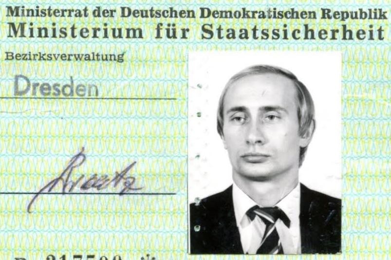 Green ID card with a young Vladimir Putin