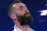 Benoit Paire leans his head back and spits on the court
