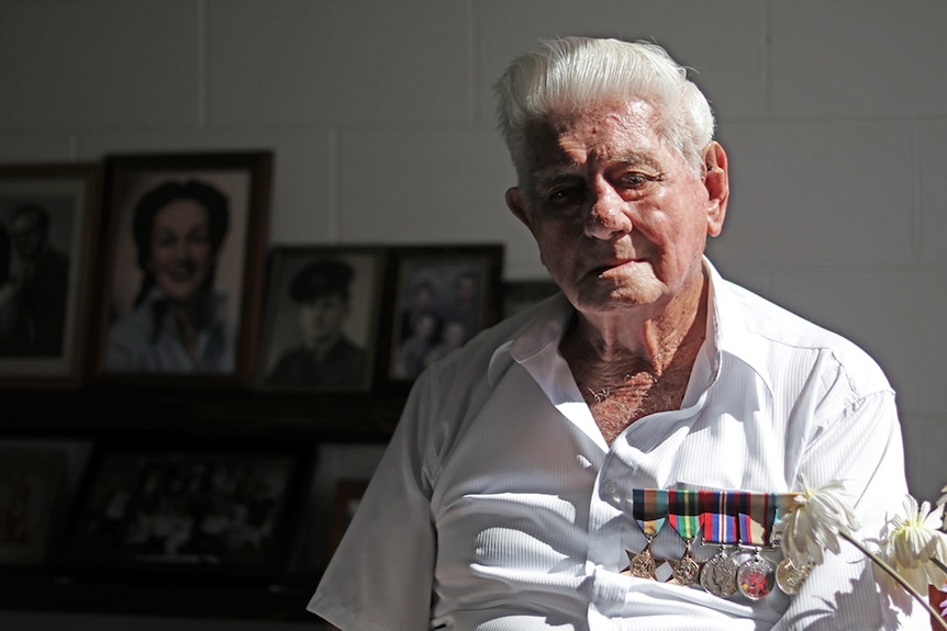 A portrait of Keith Norton in strong light, wearing medals
