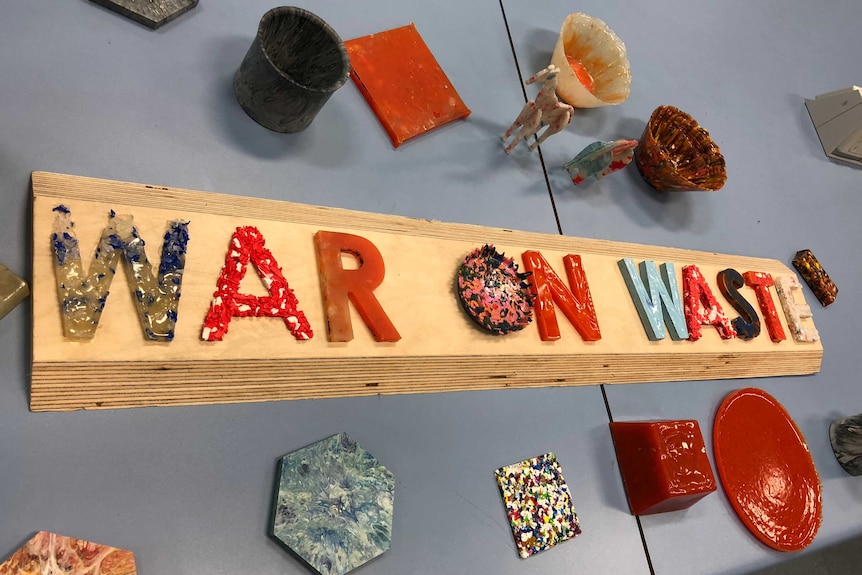 Colourful etters made from recycled plastic that spell out 'War on Waste'.