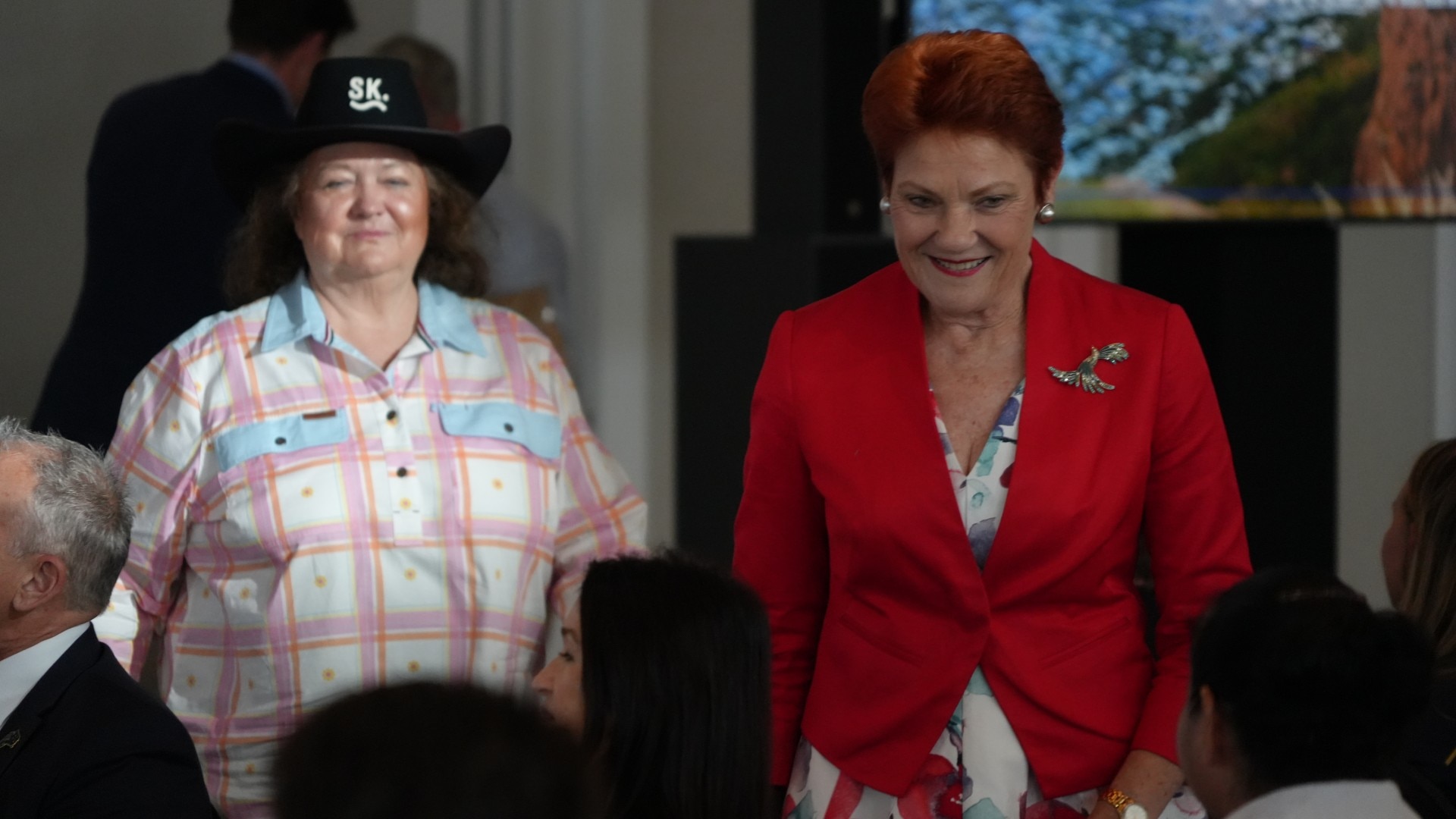 Two women on a stage.