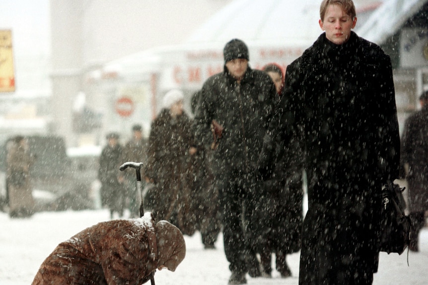 An elderly woman begs for money in Russia