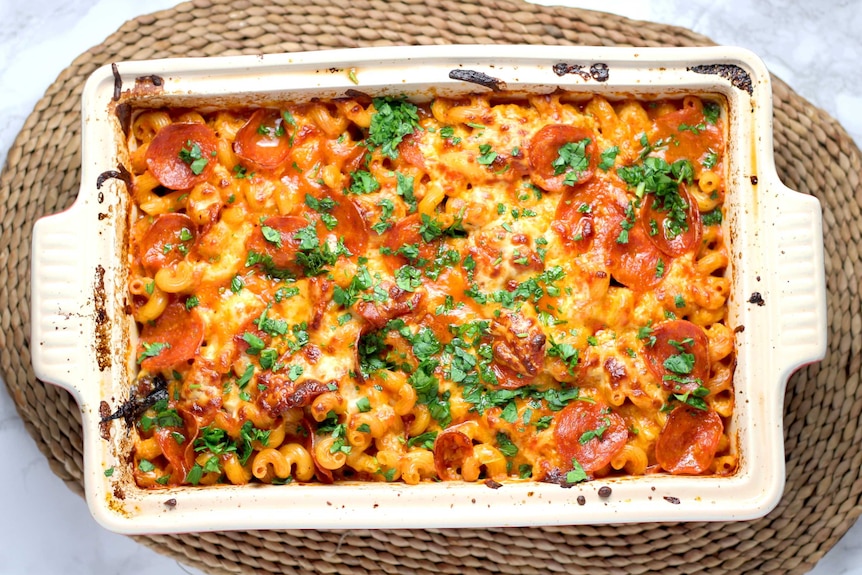 Top-down view of a pasta bake in a white casserole dish