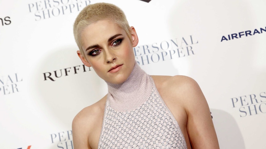 Actress Kristen Stewart poses with close cropped hair as she arrives for the premiere of her new film "Personal Shopper"