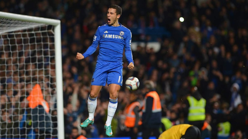 Chelsea's Eden Hazard celebrates his last-minute penalty against Manchester United.