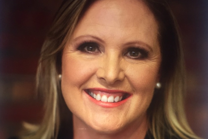 Headshot of woman smiling at camera.