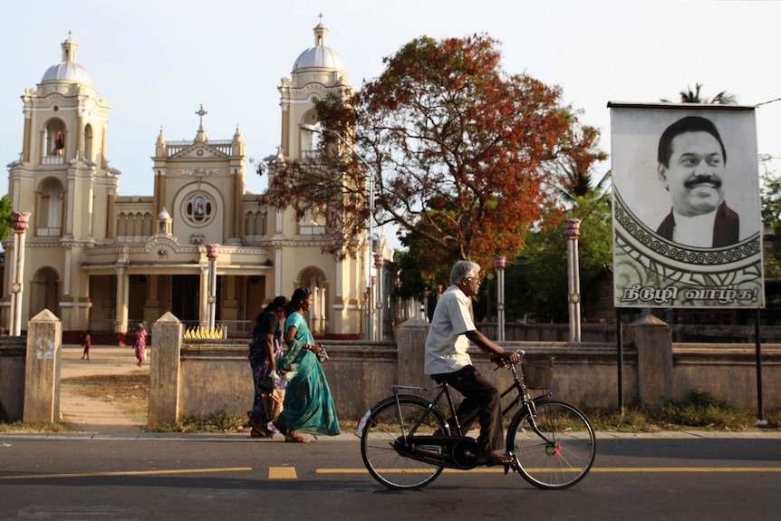A man cycles past St James Church in Jaffna, northern Sri Lanka