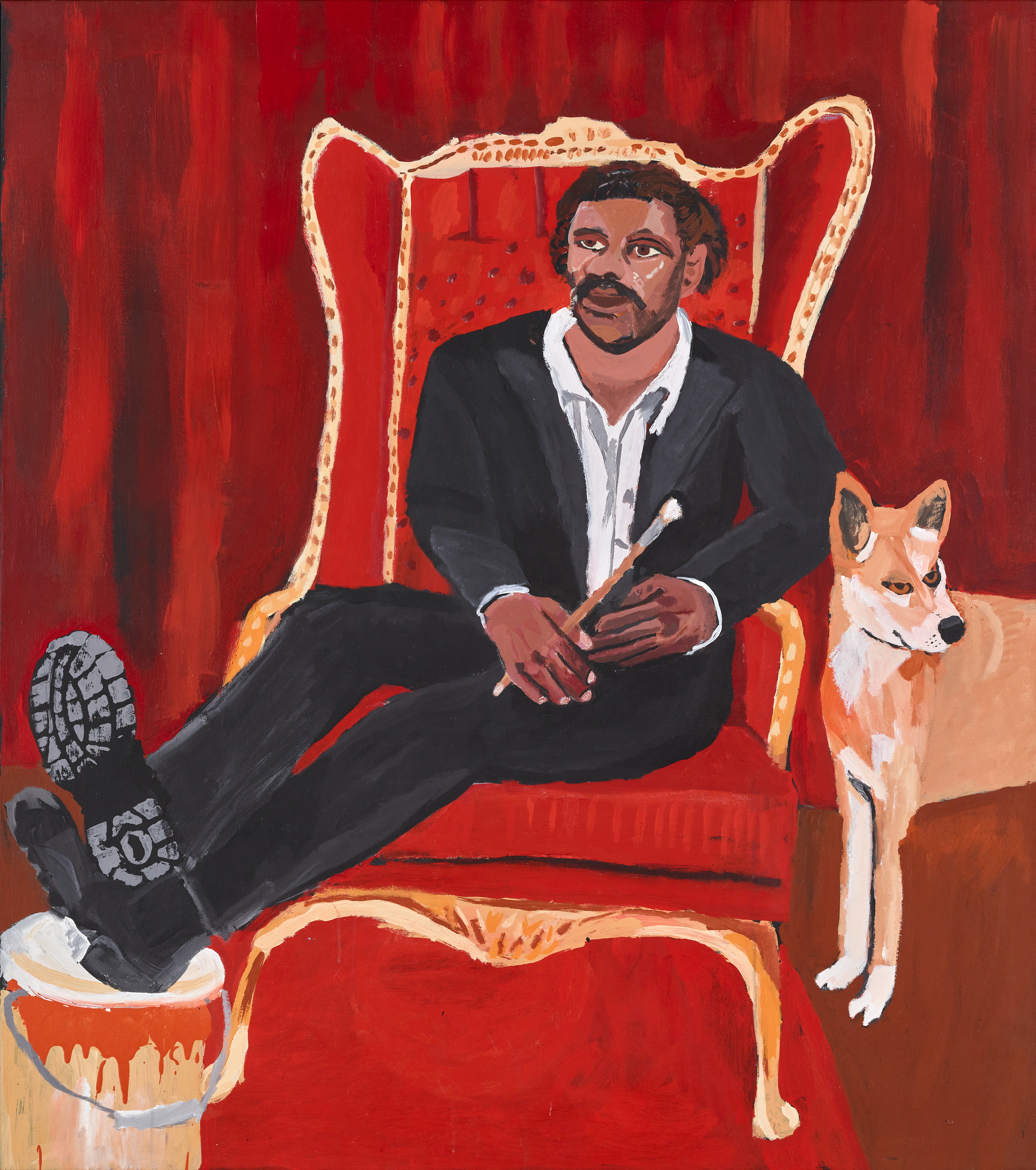 Portrait of Aboriginal Australian artist Vincent Namatjira sitting alongside a dingo