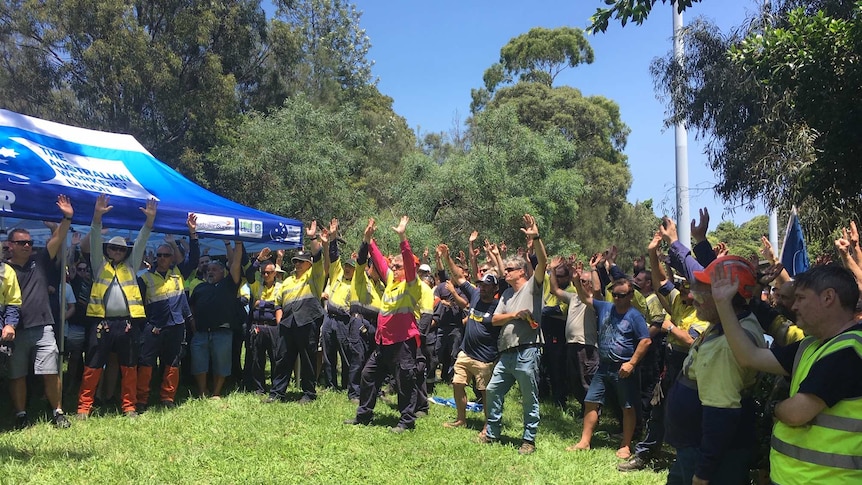 Bluescope steelworkers at a stop work meeting voting to support industrial action