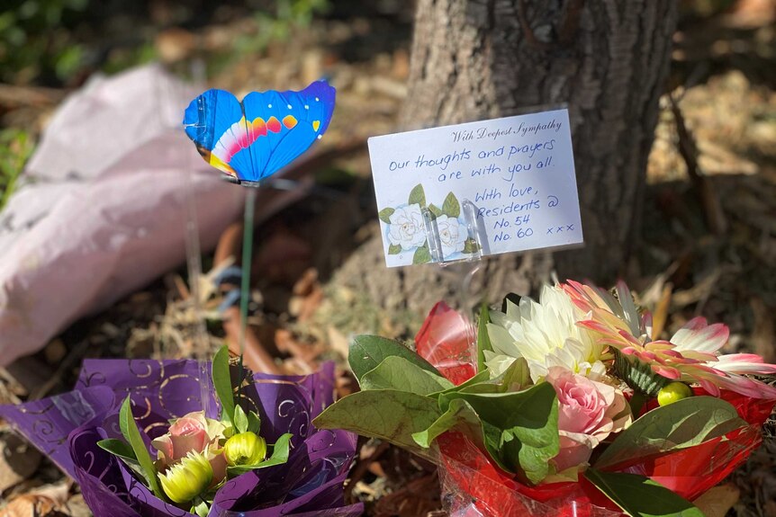 Flowers and letters left as memorial.