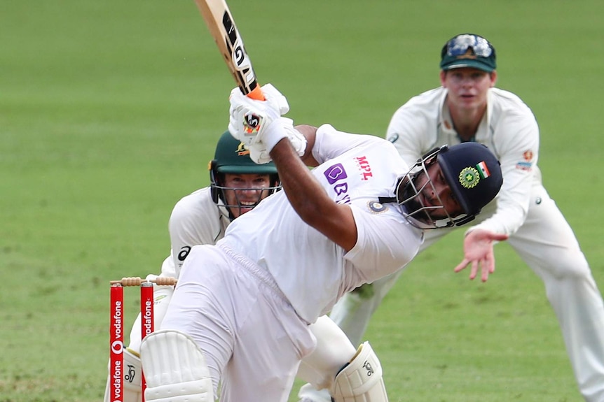 India batsman Rishabh Pant swings hard on day five of a Test at the Gabba.