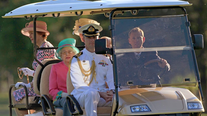 Queen Elizabeth II and Prince Philip tour the grounds of Government House in Canberra on a solar powered golf buggy