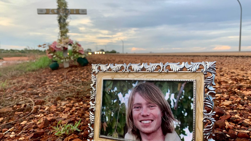 Image of a photograph of Josh Warneke placed in front of a memorial in Broome, Western Australia.