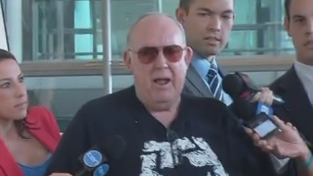 John Chardon speaks to the media after arriving at Brisbane Airport on March 7, 2014.