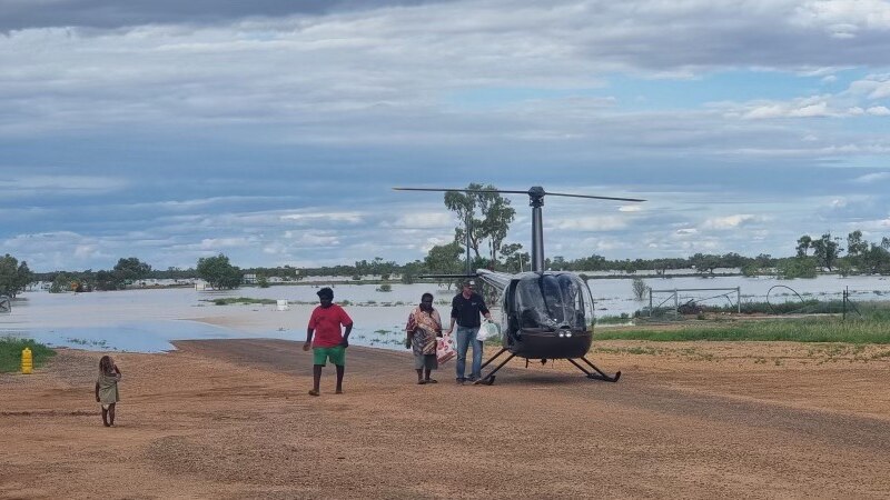 Helicopter in flooded outback area