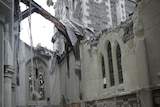 Rescue worker sifts through Christchurch cathedral rubble