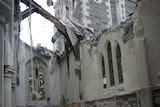 Rescue crews look for staff in the damaged Pyne Gould Guinness building in central Christchurch