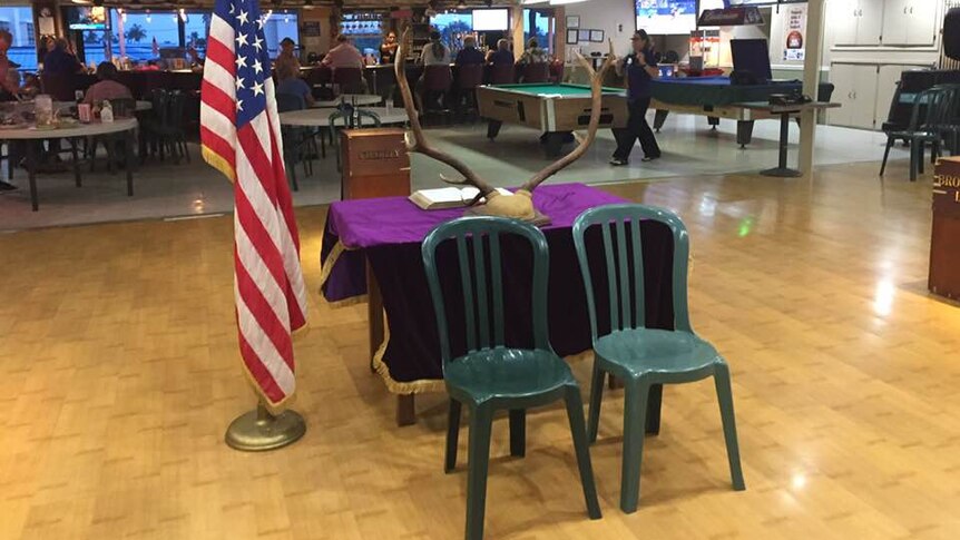 Two empty chairs at the Kona Elks Lodge, Hawaii, placed as a memorial to two chopper crash victims in the Whitsundays