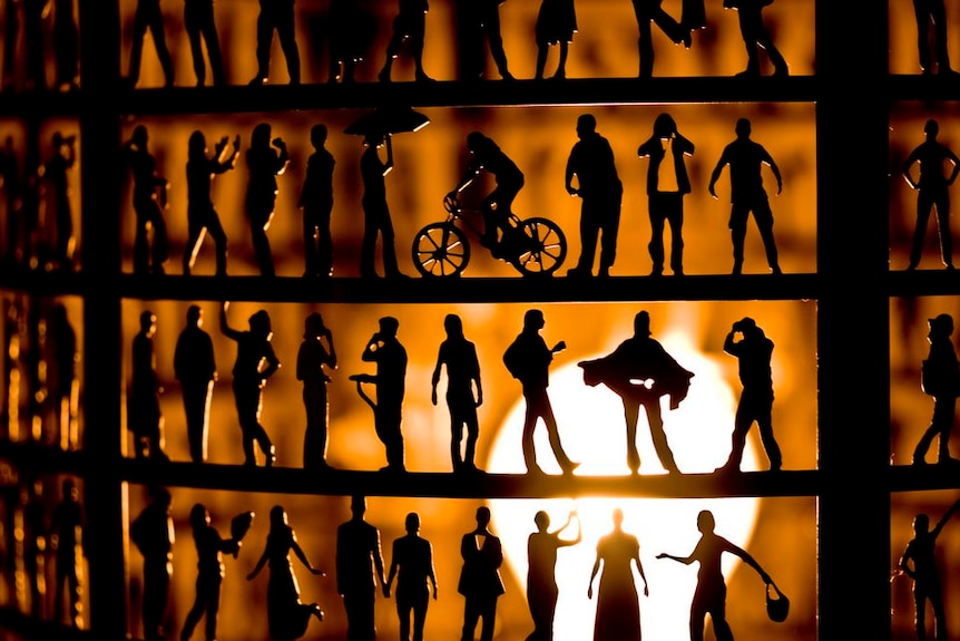 Small figures in silhouette