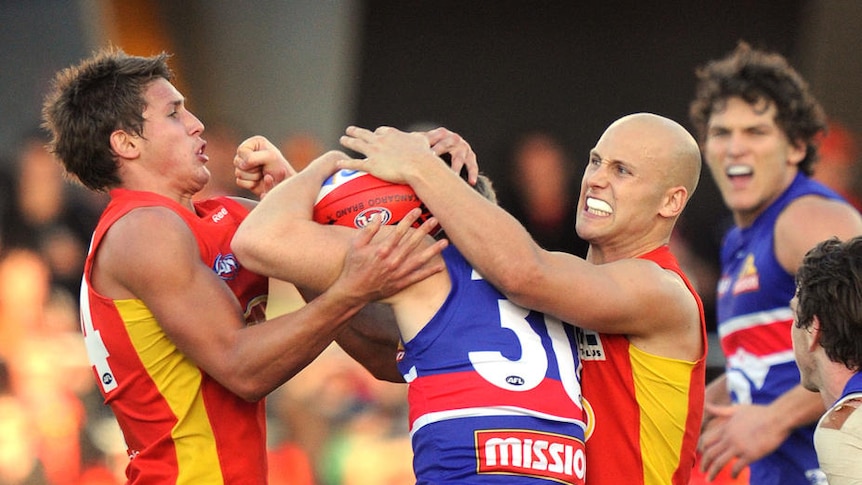 Never say die ... Gary Ablett's Suns faced a large three-quarter time deficit but came on strong in the final period.