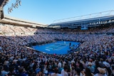 Rod Laver Arena bathed in sunshine with packed stands