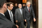 Iran's foreign minister Mohammad Javad Zarif (C) arrives for a meeting in Geneva