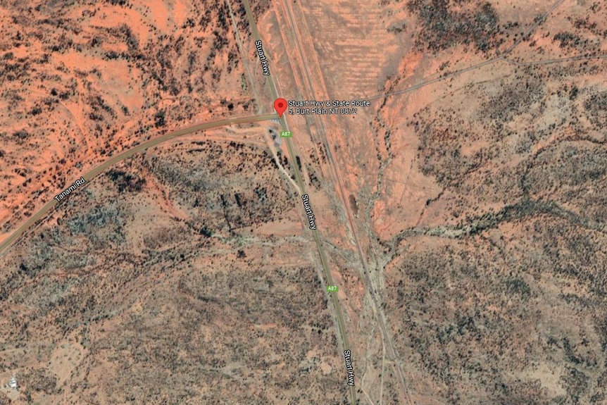 Aerial photo of red-dirt landscape at Stuart Highway and Tanami Road intersection.