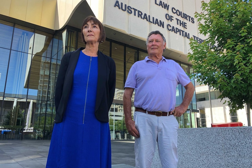 A couple stands outside the ACT courts building.