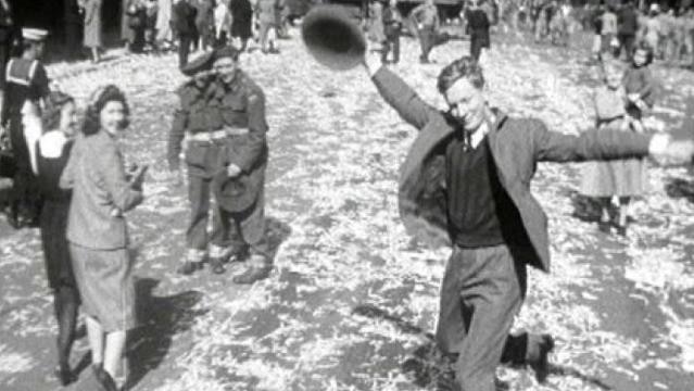 Iconic photo of man dances in street in celebration of end of WW2