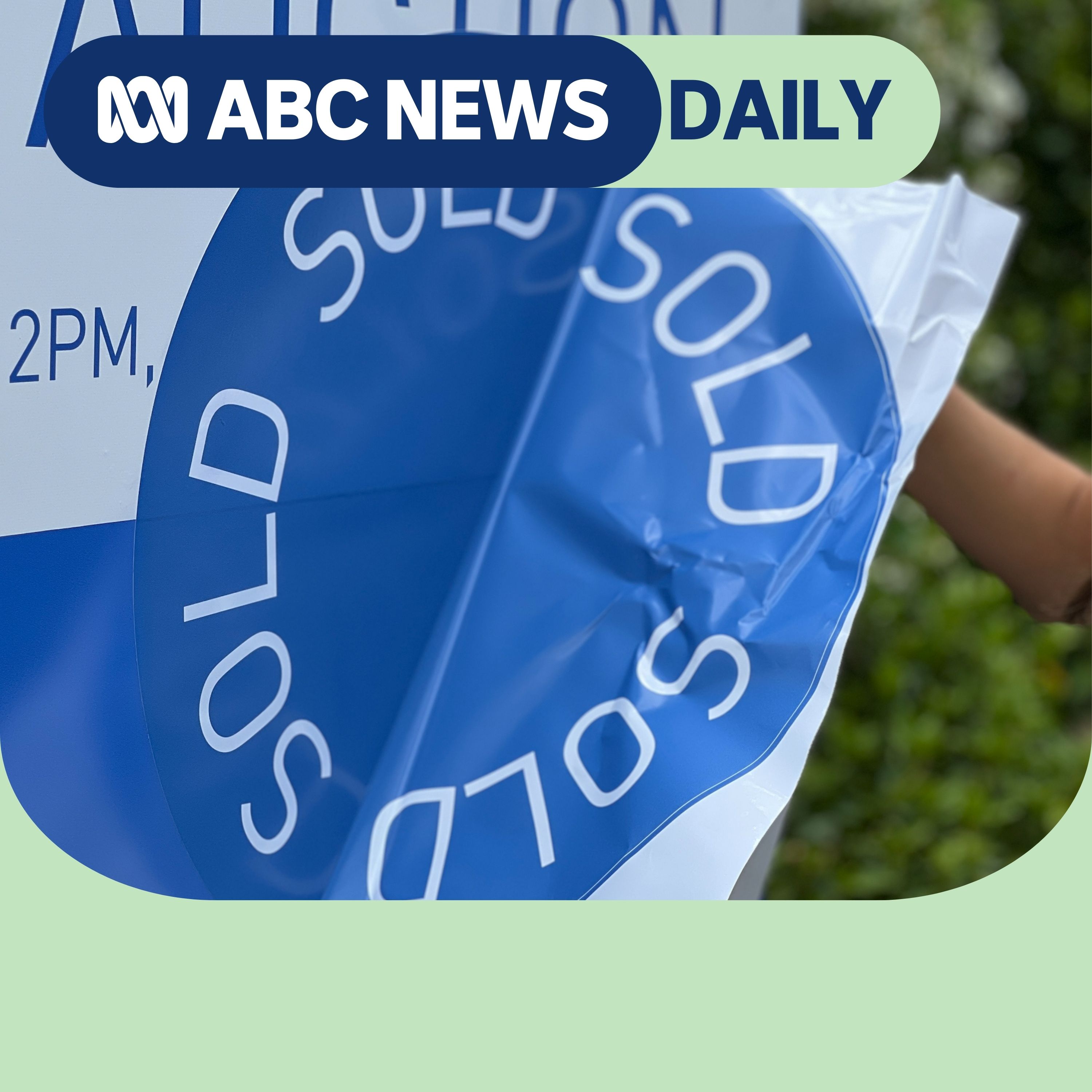 A sold sticker on an auction sign