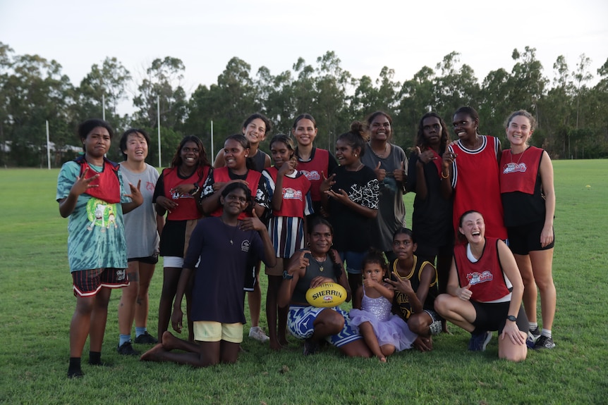 A group of footballers at the Nhulunbuy football oval.