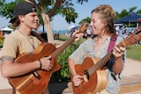  Laura Kirkup and Tyson Richardson play guitar at the markets