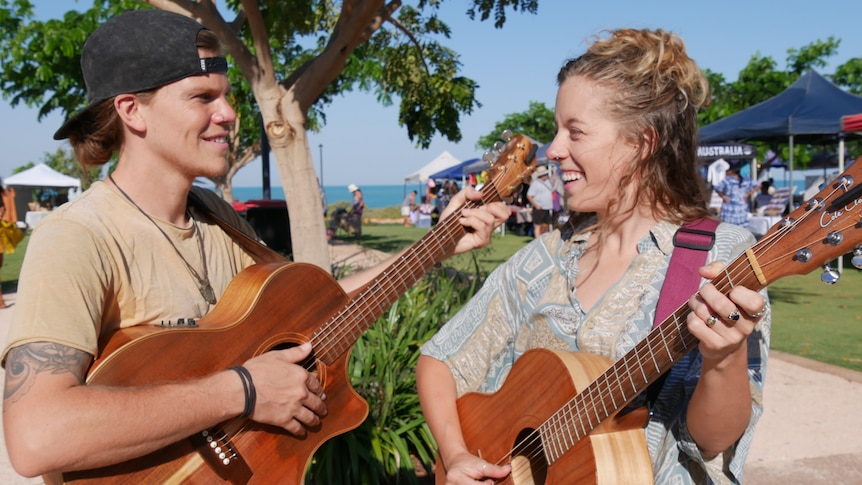  Laura Kirkup and Tyson Richardson play guitar at the markets