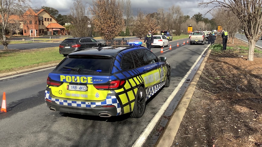 A police car on a road.