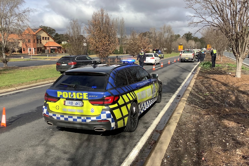 A police car on a road.