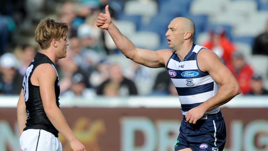 Geelong's James Podsiadly celebrates a goal against Port Adelaide in August 2013.