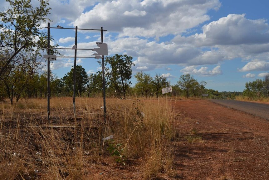 The outskirts of Doomadgee, where the sign advertising the start of alcohol restrictions has been torn down.