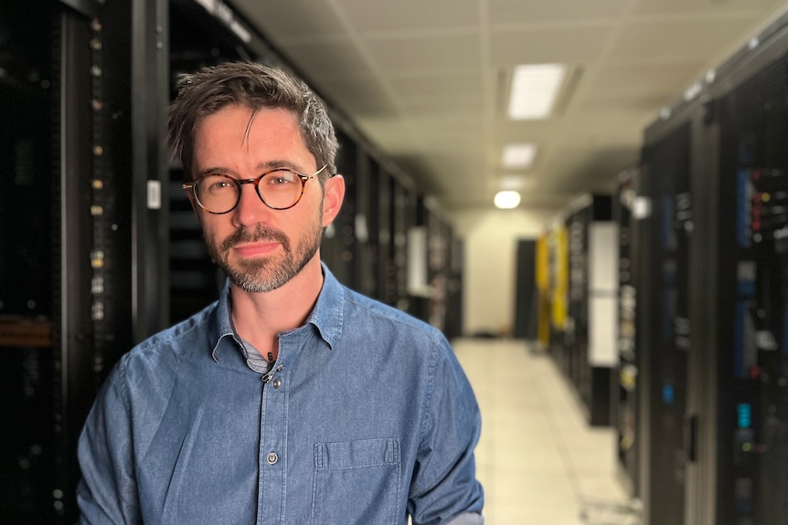 Chris Cooper inside a data storage room.