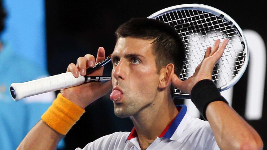 Novak Djokovic pokes out his tongue during the Hopman Cup.