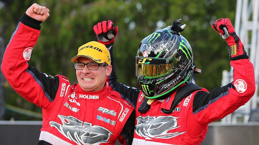 Jack Perkins (L) and James Courtney of the Holden Racing Team celebrate after the Gold Coast 600.