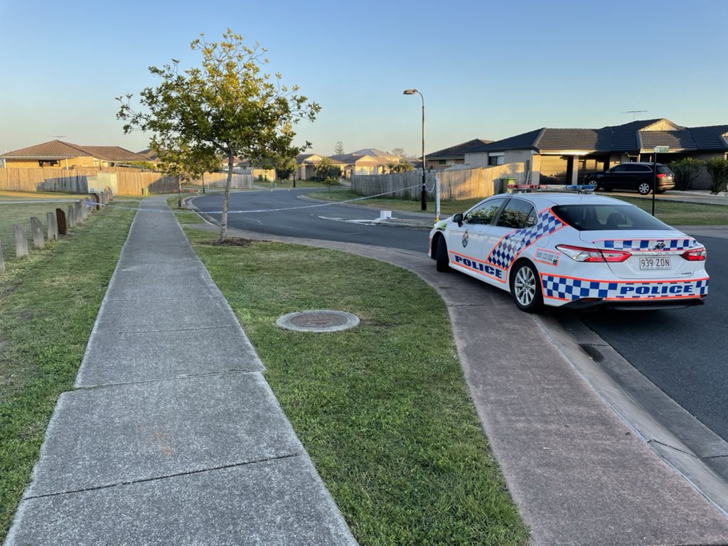 Police car at Baden Jones Way at North Booval on July 28, 2021, after shooting and street brawl