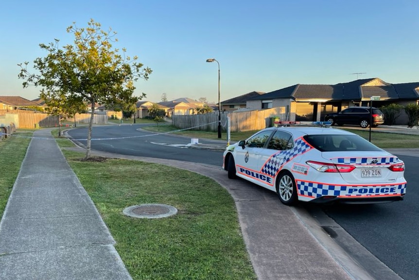Police car at Baden Jones Way at North Booval on July 28, 2021, after shooting and street brawl
