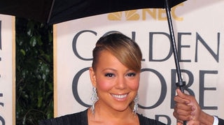 Mariah Carey poses for photos on the red carpet at the 67th Annual Golden Globe Awards held at The B