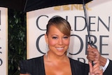 Mariah Carey poses for photos on the red carpet at the 67th Annual Golden Globe Awards held at The B